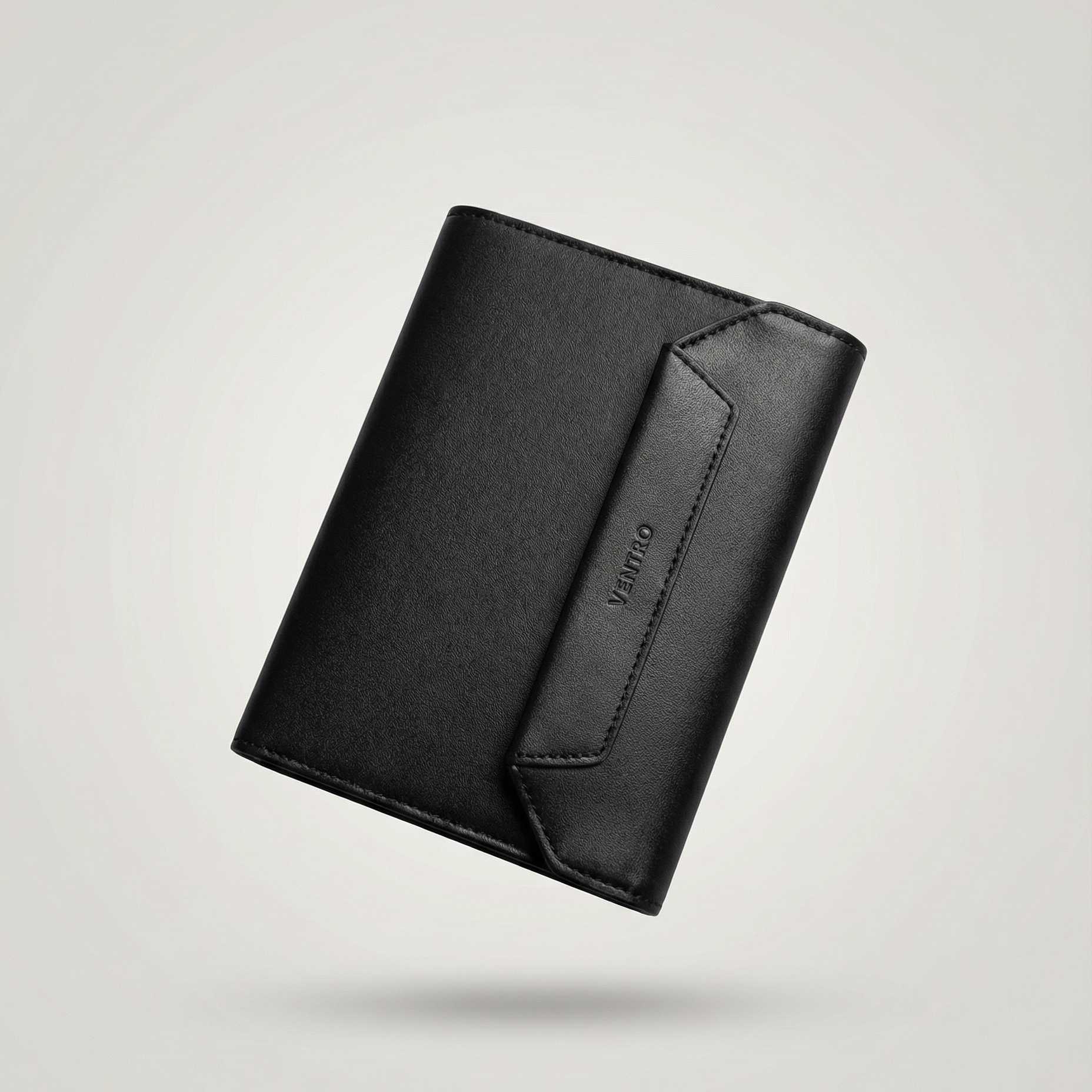 Black leather wallet on a light gray background