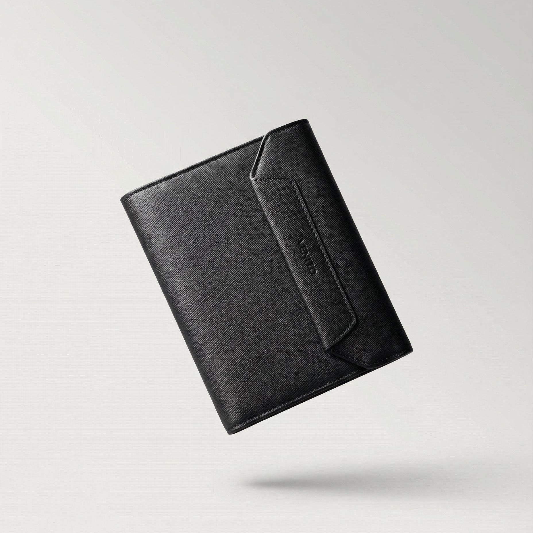 Black leather wallet on a light gray background