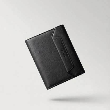 Black leather wallet on a light gray background