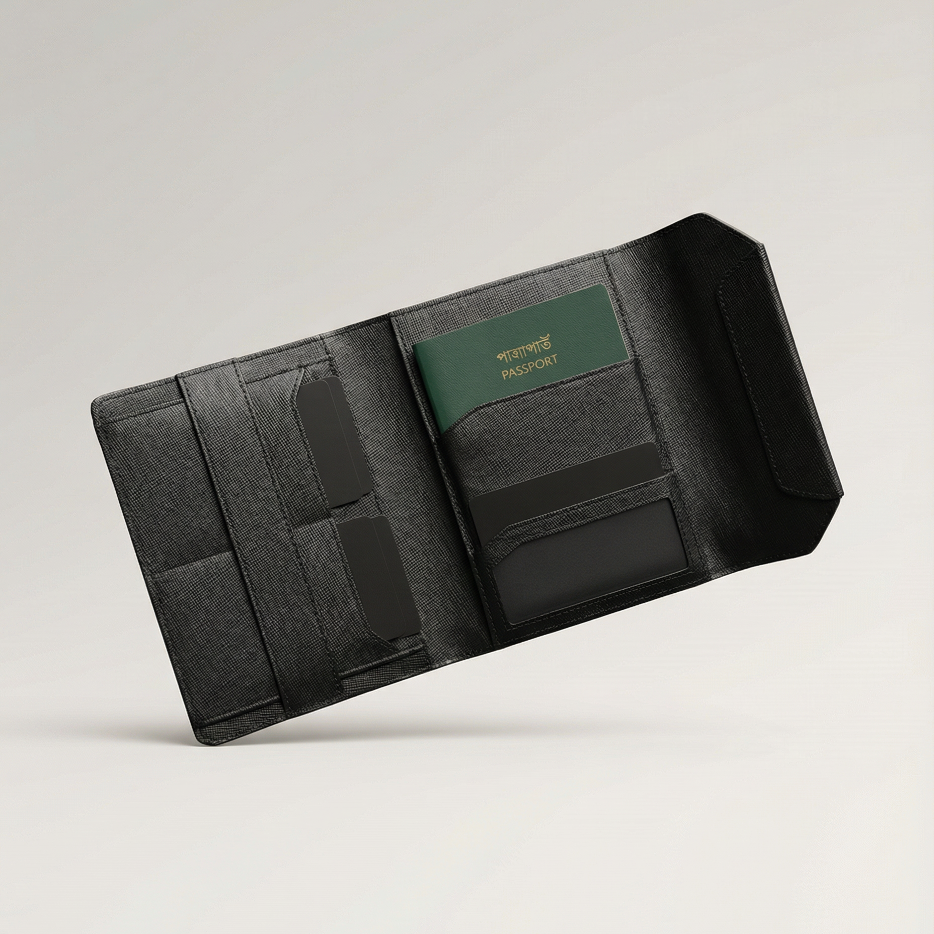 Black travel wallet with a green passport holder on a light gray background