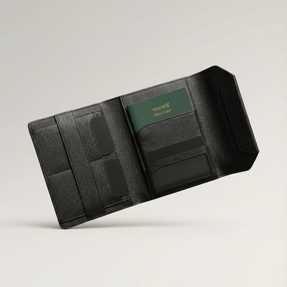 Black travel wallet with a green passport holder on a light gray background