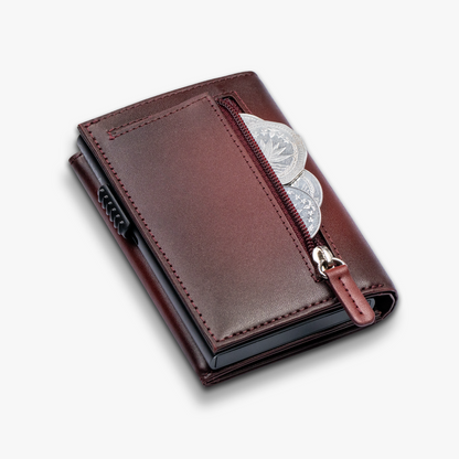 Brown leather wallet with silver emblem and pink strap on a white background. Red_mirage_ventro_nfc_wallet back side